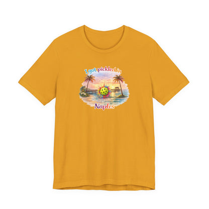 Yellow t-shirt with a tropical graphic and text on a white background