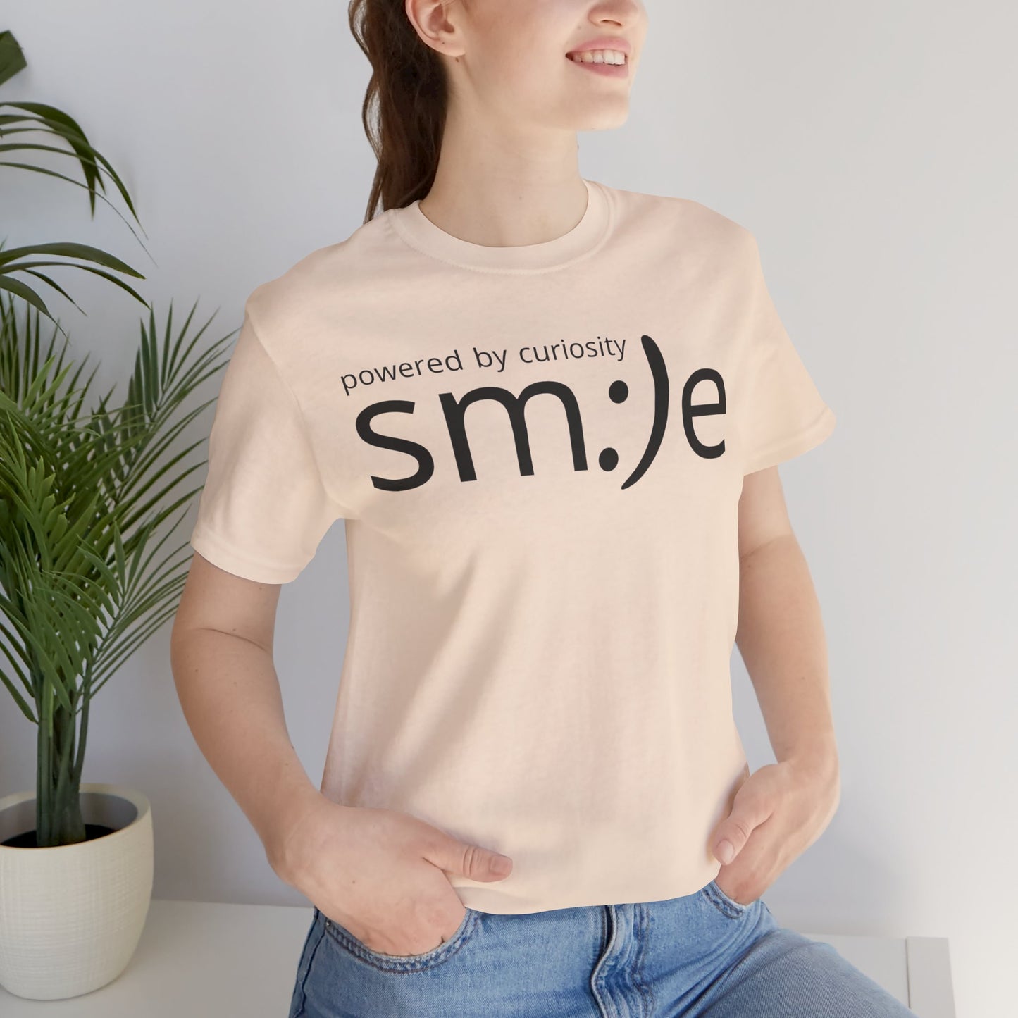 sm:)e Powered by Curiosity T-Shirt | Inspirational Unisex Graphic Tee